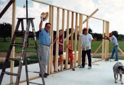 John, Melesa, Jamie holding up first wall